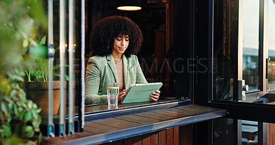 Buy stock photo Reading, remote work and tablet with woman in coffee shop for small business planning or research. App, freelance and information with African employee in restaurant as customer and entrepreneur
