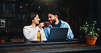 Laptop, cheers and couple with coffee in cafe with laugh, bonding or talking on morning date together. Happy, cappuccino and man with woman on computer for social media or blog with restaurant review