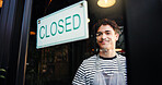Man, waiter and closed sign on cafe door for end of day, no service and message to customer. Smile, male person and signage poster for information, restaurant notice and window with store reservation