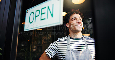 Buy stock photo Open sign, small business and window with man in coffee shop for hospitality, retail or service. Entrance, opening and smile of waiter in cafe or restaurant for startup announcement or signage