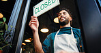 Man, server and closed sign on cafe door for end of day, no service and message to customer. Below, male person and signage poster for information, restaurant notice and window with store reservation