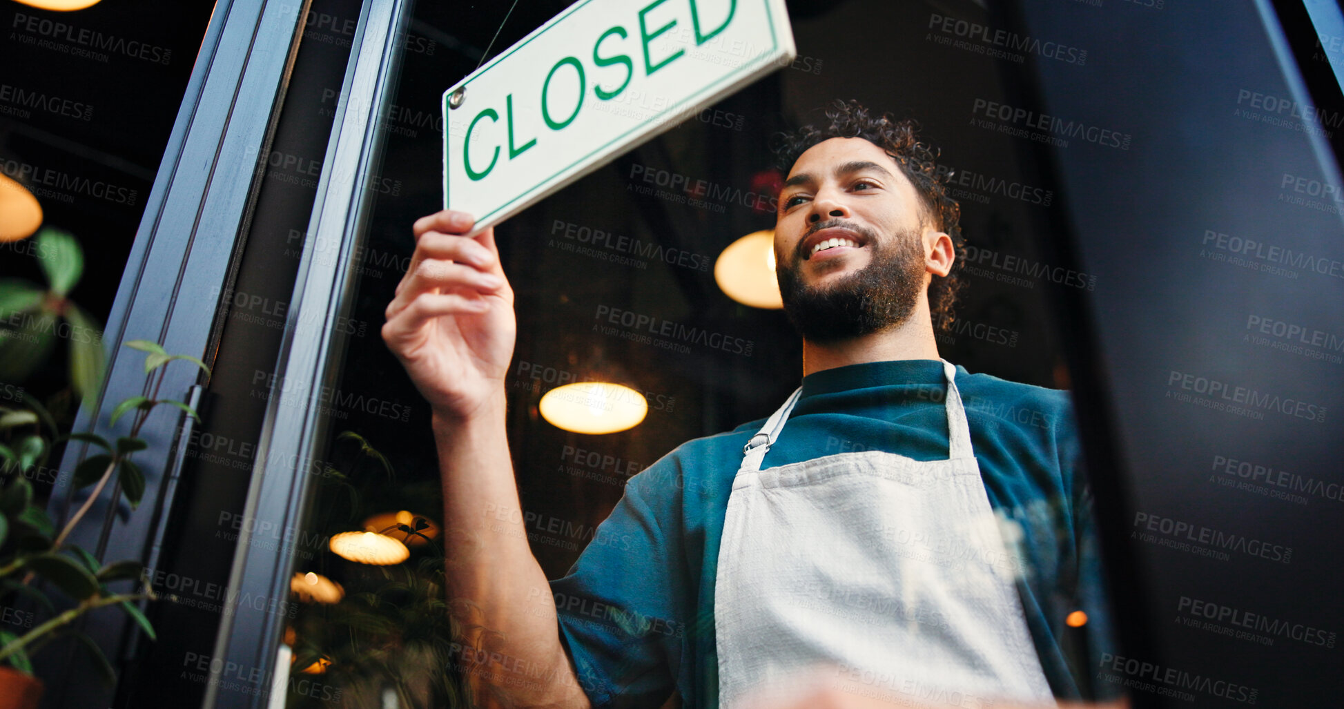 Buy stock photo Man, server and closed sign on cafe door for end of day, no service and message to customer. Below, male person and signage poster for information, restaurant notice and window with store reservation