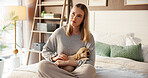 Thinking, woman and relax with puppy in bedroom for love, care and bonding together with companion. Girl, dog mom and stroke pet in bed at home for connection, daydreaming or reflection with labrador