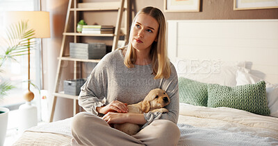 Buy stock photo Thinking, woman and relax with puppy in bedroom for love, care and bonding together with companion. Girl, dog mom and stroke pet in bed at home for connection, daydreaming or reflection with Labrador
