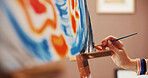 Hand, paint brush and stroke on canvas at workshop, color or creative process with design for artwork. Person, artist and lines with talent, inspiration and tools with abstract project at home studio