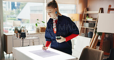 Buy stock photo Drafting table, drawing and phone with woman in studio apartment for remote work or sketch. App, illustration and paper with freelance artist in home office for craft process or creative industry