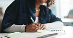 Woman, hands or student writing with book in classroom for education, learning or studying. Closeup, female person or academic learner taking notes with notebook for project, assessment or curriculum
