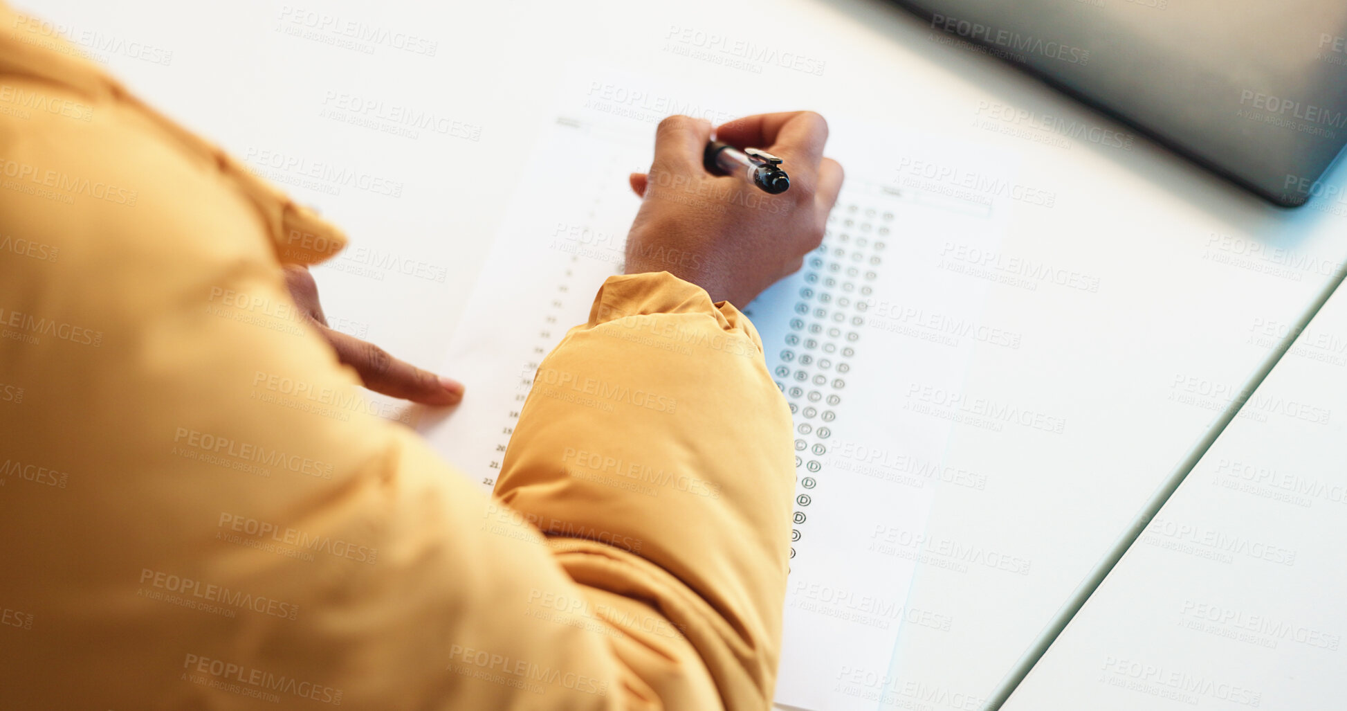 Buy stock photo Person, hands and student with test for multiple choice, exam or assessment in classroom. Top view, academic learner or writing with decision or selection for knowledge, curriculum or paper in class