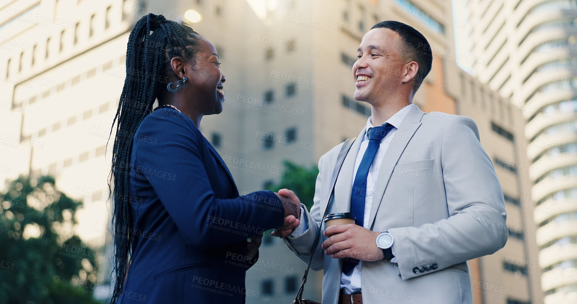 Buy stock photo Handshake, meeting and business people in city, partnership or b2b deal with agreement. Employees, below or financial consultant with cooperation, shaking hands or networking with investment agency