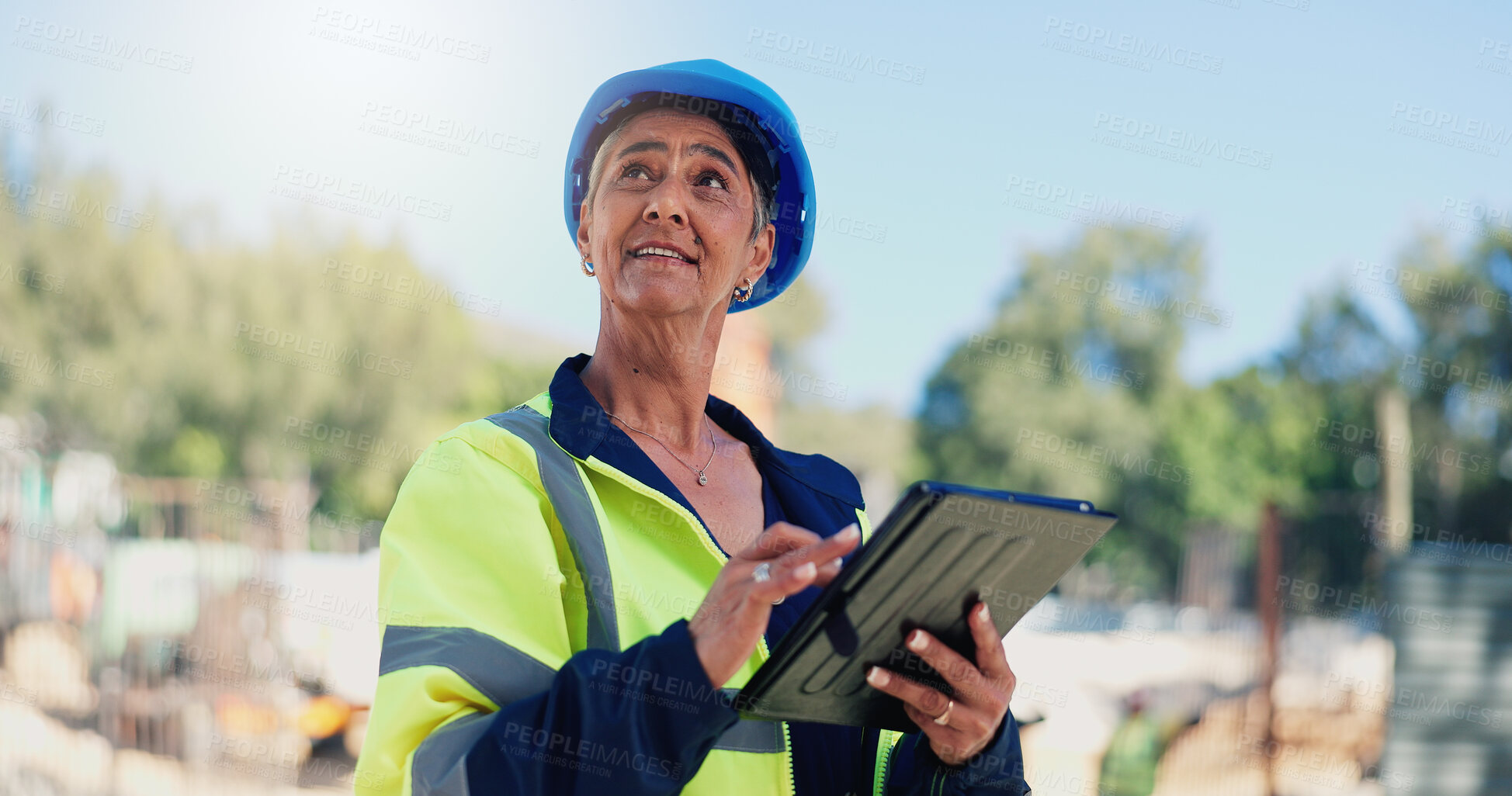 Buy stock photo Architect, woman and tablet at construction site, typing and progress report for building project. Mature person, engineer and contractor with property expansion, tech and happy with app in Mexico