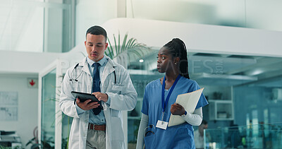 Buy stock photo Tablet, doctor and nurse in hospital for healthcare discussion, planning schedule or telehealth. Medical team, man and woman with technology for wellness report, collaboration and diagnosis feedback