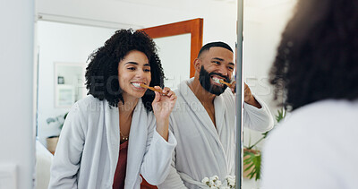 Buy stock photo Couple, brushing teeth or mirror in bathroom for dental care, wellness or morning in home. Man, woman or oral hygiene with reflection or toothbrush for routine, cleaning mouth or gum health in house