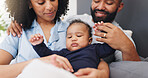 Parents, embrace and baby boy at house with love, security and comfort for bonding together. People, relax and holding infant for protection, emotional support and connection for growth development