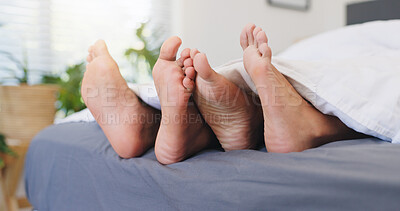 Buy stock photo Sleeping, couple and feet on bed, home or comfortable in bedroom, relationship or together on break. Barefoot, people and rest on mattress in house, relax and free time on weekend, legs and apartment