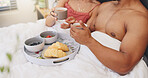 Relax, couple and hands with breakfast, hotel and bonding with coffee on bed, healthy food or fruit. Comfortable, people and caffeine in motel, rest and break with tea on holiday, meal and getaway