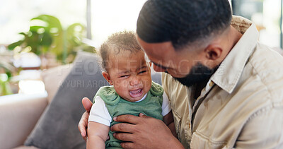 Buy stock photo Sofa, father and comfort crying baby with bonding together, frustrated and discomfort with teething. Single dad, people and console sad infant in home with attention, parenting and child development