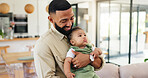 Happy, carry and dad with baby on sofa for bonding, loving relationship and development on weekend. Family, home and father holding child for safety, support and affection in living room together