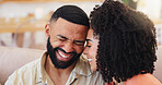 Happy couple, laughing and funny joke on sofa for humor, comedy or relationship in home. Man, woman or lovers with smile or laughter for gossip, bonding or hilarious conversation together in house