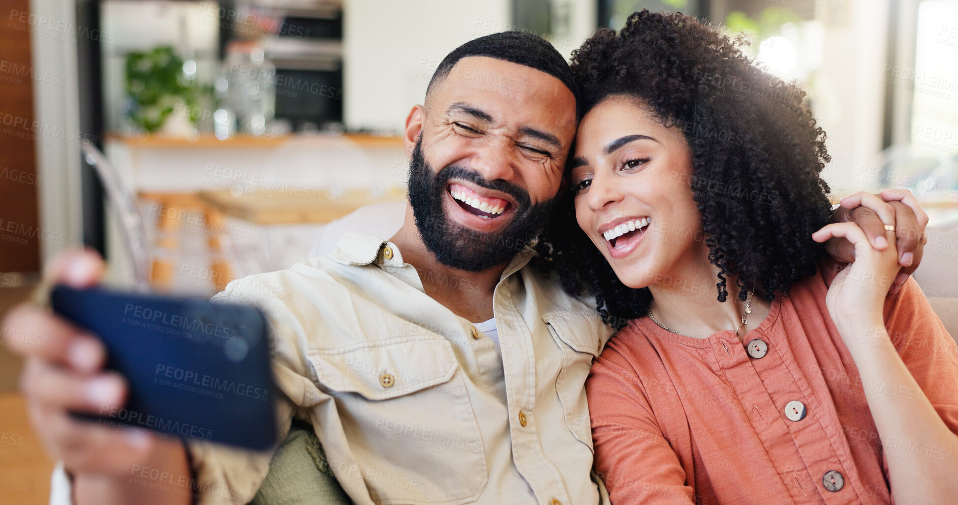 Buy stock photo Happy couple, laughing and sofa with selfie in home for picture, photography or memory together. Man, woman or lovers with smile, hug or capture for funny moment, bonding or holiday on couch in house