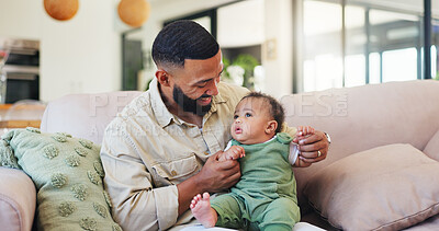 Buy stock photo Happy, playing and dad with baby on sofa for bonding, loving relationship and development. Family, home and father relax with child on couch for safety, support and care in living room together
