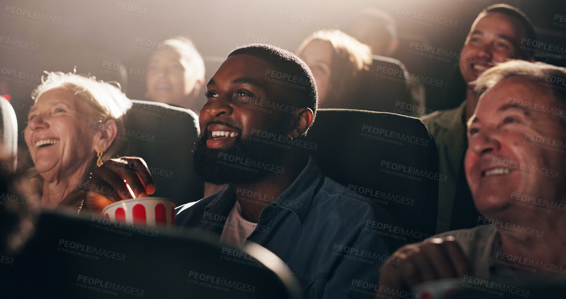 Buy stock photo Watching, film and man with popcorn, movie theater and smile for premiere, weekend or entertainment. Happy, fan and people with snack for fantasy, audience and crowd at cinema, night and laughing
