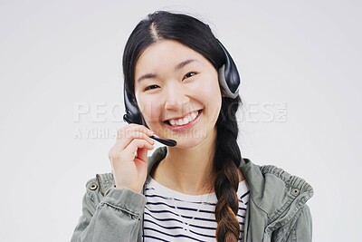 Buy stock photo Portrait, woman and headset for call centre, communication and smile by white background. Asian female person, happiness and microphone for talking, crm agent and consultant in studio on backdrop