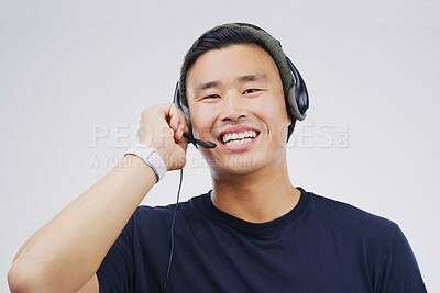 Buy stock photo Headset, asian man and smile in call center in portrait on white background with telemarketing or crm. Customer support, help and technology with voip for contact on internet with telemarketer