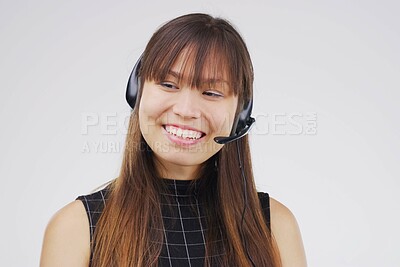 Buy stock photo Asian woman, smile and headset in studio on white background for consultant, call centre and crm. Female person, happy and headphones with mic for customer support, connectivity and communication