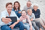 Family, generations and selfie, together and happy on outdoor adventure at beach, smartphone and technology. Parents, grandparents and children smile, spending quality time and bonding at the coast.