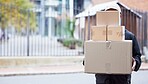 Courier person, street and walking with boxes, service and delivery in urban city for supply chain job. Logistics worker, package and road for customer satisfaction, product and commerce in metro cbd