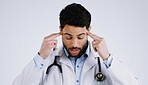 Man, doctor and headache in stress, anxiety or burnout for overworked against a gray studio background. Male person, medical surgeon or nurse with migraine in depression, mental health or pressure