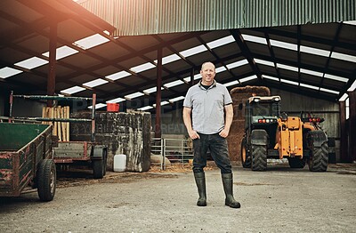 Buy stock photo Farm, tractor and portrait of man in barn with equipment for farming, harvest and production. Agriculture, countryside and farmer with machine in shed, factory and storage with plow truck for fields