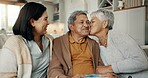 Birthday, gift and senior parents on sofa for celebration, festive event and bonding together at home. Happy family, party and elderly mother and father with daughter for present, surprise and love