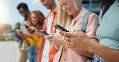 Buy stock photo Hands, students and friends with phone at college, smile and texting with social media, app or communication. Men, women and diversity with smartphone, reading and web chat with search for funny meme