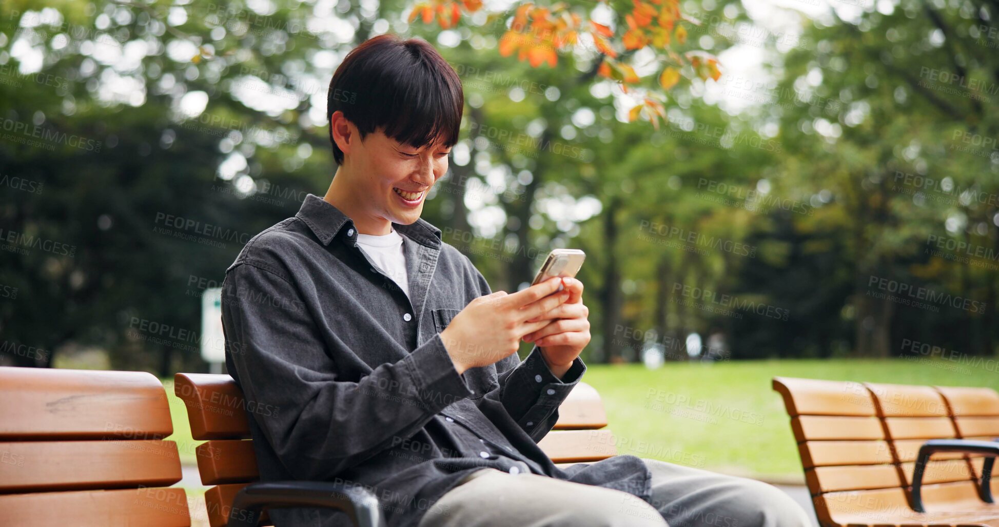 Buy stock photo Japanese man, smile and phone outdoor of travel location, communication and directions translation. Happy, person and mobile with contact, map guide and information of morning commute in Japan nature