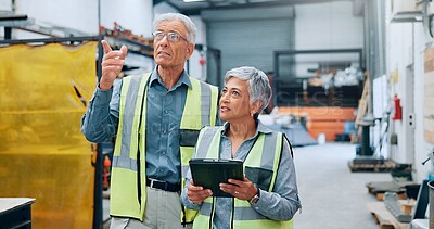 Buy stock photo People, engineer and explain with tablet at factory for planning, supply chain and inventory management. Mature staff, team and digital for manufacturing, logistics feedback and production checklist