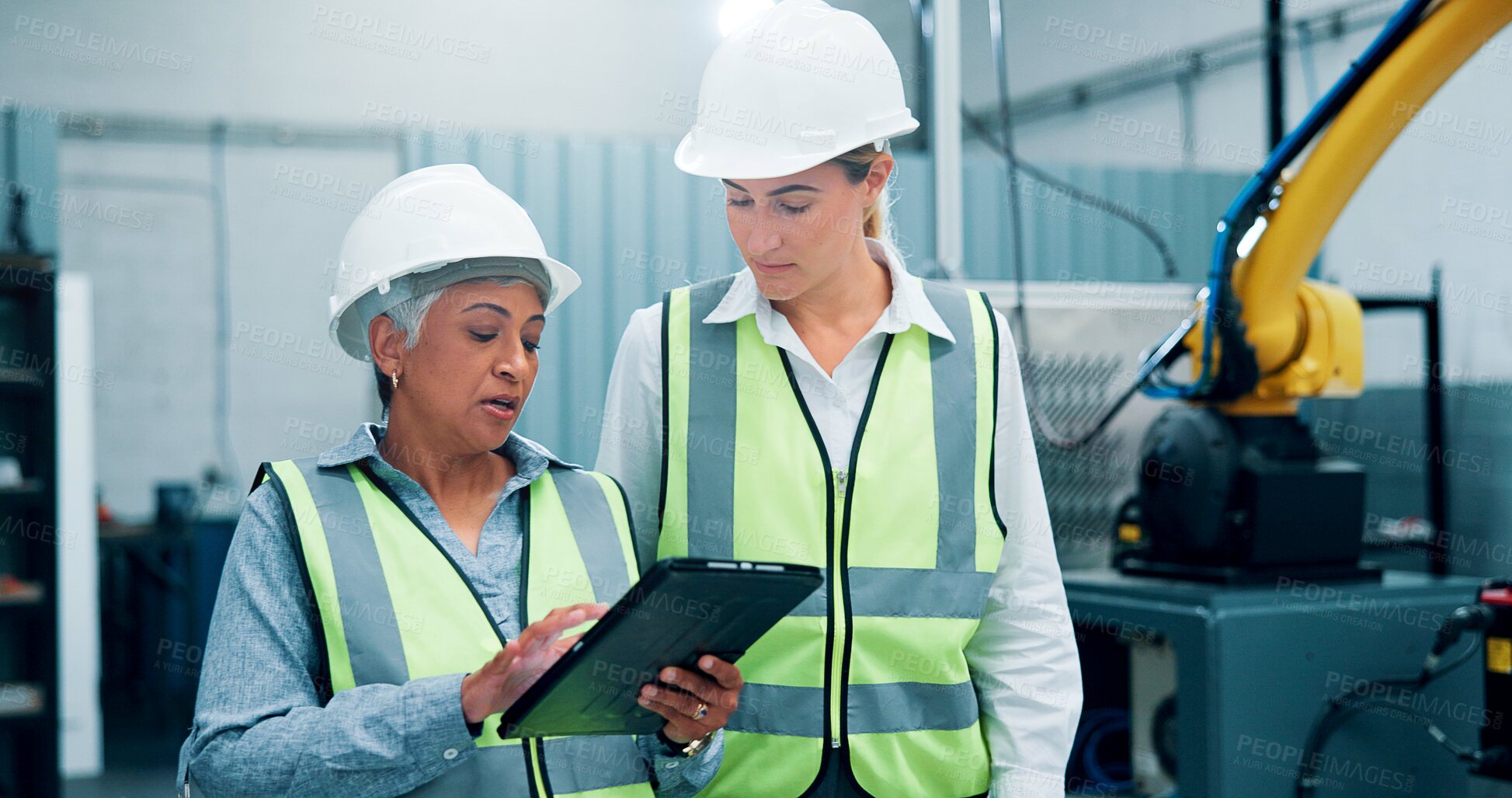 Buy stock photo Women, robotics and meeting in lab, tablet and conversation with software update. Employees, engineering and people in warehouse, tech and inspection with digital app, design review or cooperation