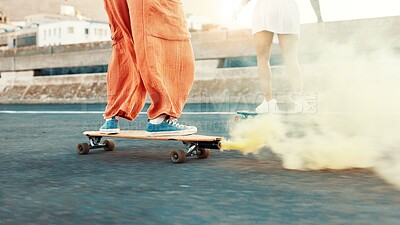 Buy stock photo Skateboard, smoke and shoes with friends in city for gen z youth, streetwear fashion and balance. Fitness, energy and travel with people skating in street for riding, hobby and action together