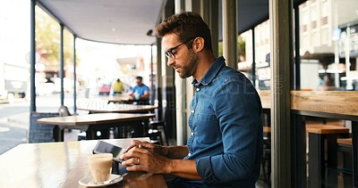 Buy stock photo Customer, man and typing on tablet at cafe for online research, coffee break and remote work. Freelancer, person and scroll on digital app at bistro for networking, email response and check schedule
