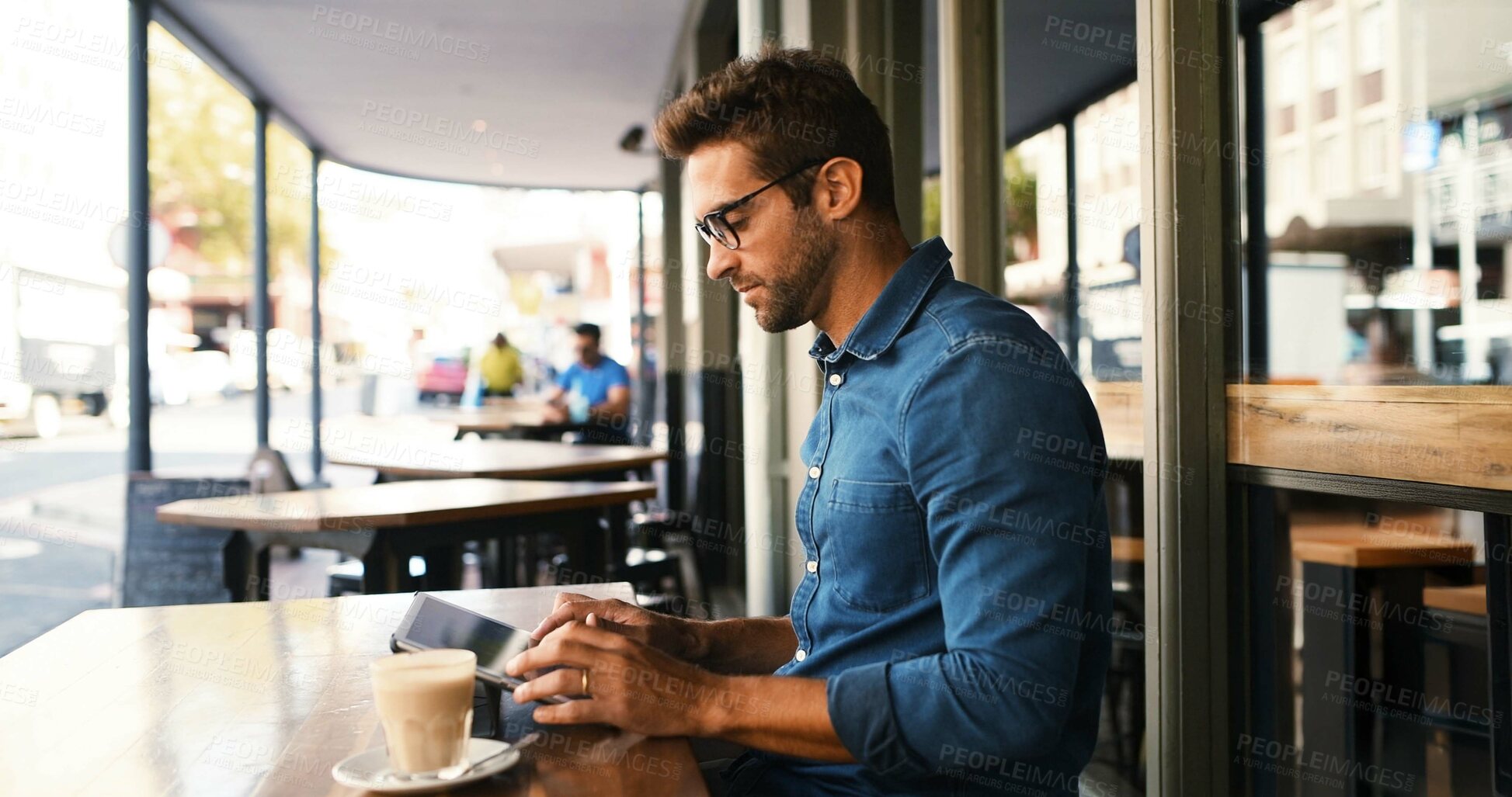 Buy stock photo Customer, man and typing on tablet at cafe for online research, coffee break and remote work. Freelancer, person and scroll on digital app at bistro for networking, email response and check schedule