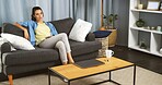 Home, sofa and woman for watching tv to relax, thinking and subscription service in living room. House, female person and chilling with thoughts while streaming film, serious and phone in lounge