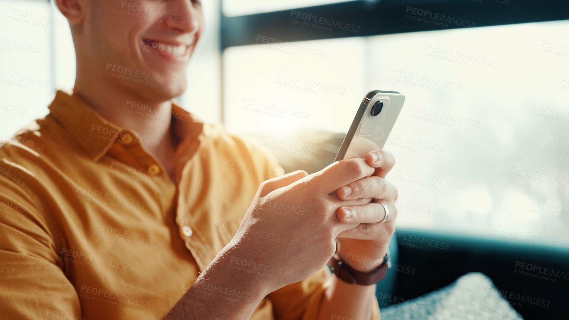 Buy stock photo Playing, video games and man with smartphone, house and entertainment for gamer with tech in lounge. Chilling, player and person with mobile app for virtual sport, smile or online for digital fantasy