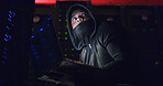 Night, scared and man on laptop for hacking, programming or cybersecurity website. Software attack, late or hacker with mask in dark room for big data research, system update or online scam operation