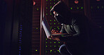 Mask, man or hacking with laptop for cybersecurity, programming or breach in night. Software attack, late or hacker with tech in dark room for big data research, system leak or online scam operation
