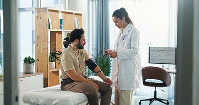 Buy stock photo Blood pressure, test and doctor with man in clinic for medical exam, checkup and consulting. Healthcare, hospital and patient with equipment to monitor for heart rate, wellness and hypertension