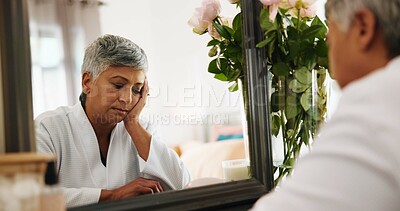 Buy stock photo Sad, senior woman and thinking in bedroom for grief, mourning loss and insecure of skincare. Contemplating, elderly person and self doubt with reflection, regret decision and shame for appearance