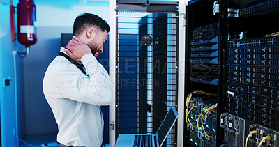 Buy stock photo Programmer, neck pain and man in server room, joint injury and laptop with muscle tension. IT specialist, tech and person with database, fatigue or burnout with inflammation, exhausted or maintenance