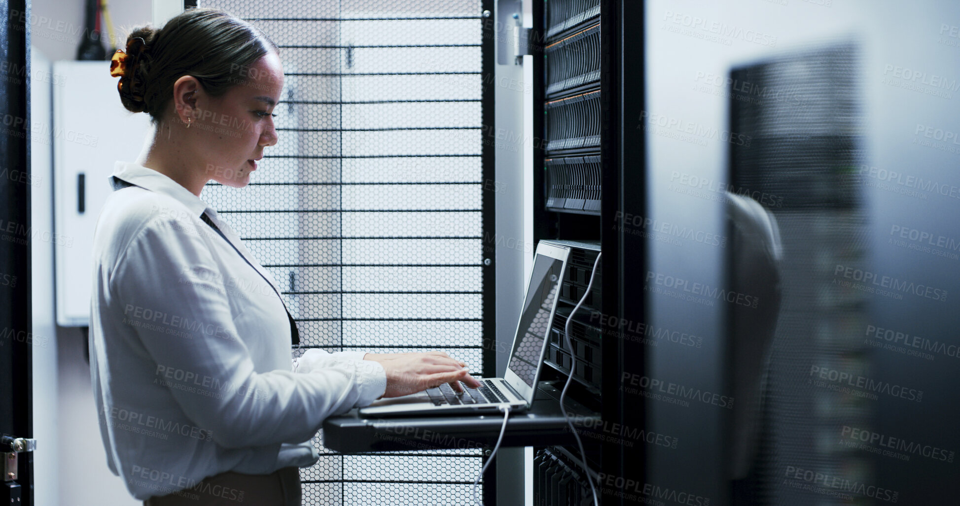 Buy stock photo Laptop, typing and woman in server room for cybersecurity, network maintenance or programming. Administration, computer and firewall installation with IT professional in data center for engineering