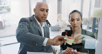 Buy stock photo Brainstorming, people and discussion with sticky notes, glass or team with info for risk assessment. Business analyst, planning and strategy for proposal, man and collaboration with woman in office