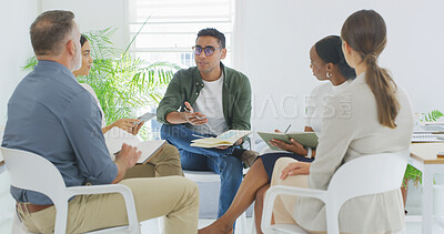 Buy stock photo Creative, man and meeting with staff in office for discussion, planning and article feedback. People, journalist and manager speaking for teamwork, story brainstorming and information for publication